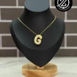 Inicial Oro laminado - globito con circo...