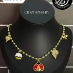 Cadena bolitas con charms: catarina, tar...